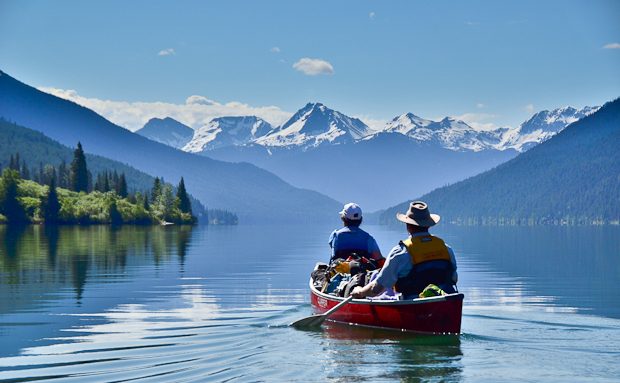 Sunny day Bowron Lake wilderness canoeing adventure